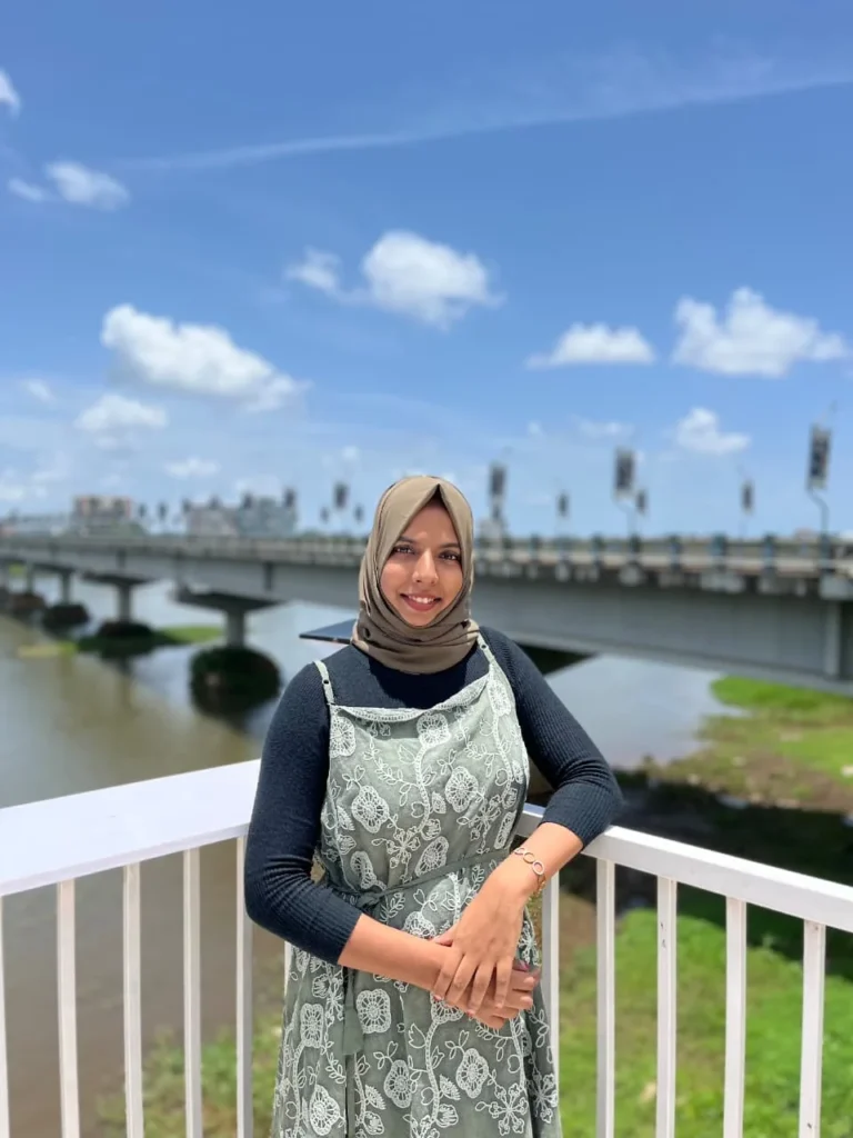 Nazrin Digital Marketing Expert in Ernakulam and Kochi, standing by the riverside bridge in Kochi